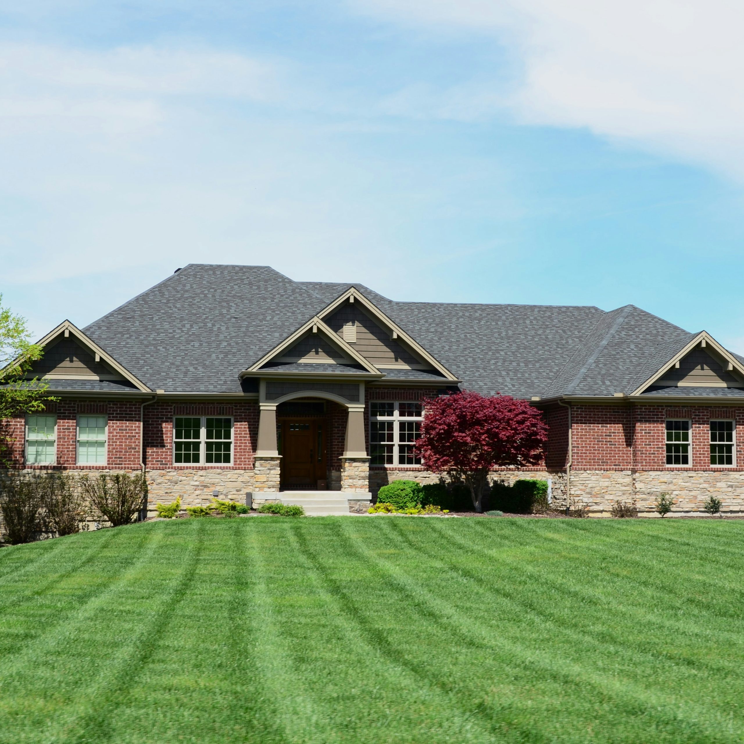 house with a large front lawn